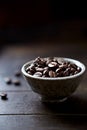 Coffee beans in a small ceramic dish. Royalty Free Stock Photo