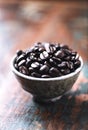 Coffee beans in a small ceramic dish. Royalty Free Stock Photo