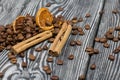 Coffee beans and spices. On a surface of brushed pine boards painted black and white Royalty Free Stock Photo