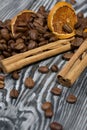 Coffee beans and spices. On a surface of brushed pine boards painted black and white Royalty Free Stock Photo