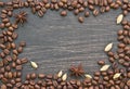 Coffee beans and spices on wooden background