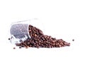 coffee beans spilled from a glass cup isolated on white background Royalty Free Stock Photo