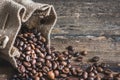 Coffee Beans Spilled out of Burlap Sack Royalty Free Stock Photo