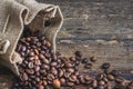 Coffee Beans Spilled out of Burlap Sack Royalty Free Stock Photo