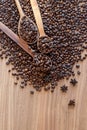 Coffee beans spilled on a wooden table