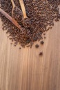 Coffee beans spilled on a wooden table