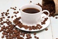 Coffee beans spilling out of a cup Royalty Free Stock Photo