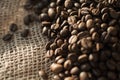 Coffee beans on a table with burlap. Royalty Free Stock Photo