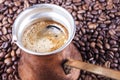 Coffee beans, vintage copper coffee pot closeup, cezve or ibrik