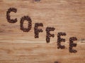 Coffee beans which are lined with the inscription Coffee. Royalty Free Stock Photo