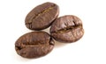 3 coffee beans on a white background. Arabica isolated close up Royalty Free Stock Photo