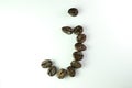 Alphabet J form Coffee beans in white background Royalty Free Stock Photo