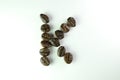 Alphabet K form Coffee beans in white background Royalty Free Stock Photo