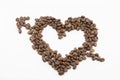 Coffee beans on a white background in the form of a heart with arrow isolated Royalty Free Stock Photo