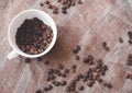 Coffee beans and a white cup on brown rustic raw sackcloth fabric photo. A4 A5 A3 international paper slide poster card with free