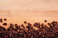 Coffee beans scattered wood background border Royalty Free Stock Photo