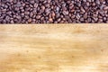 Coffee beans on wood background