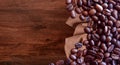 Coffee beans on wood table background vintage style for graphic design