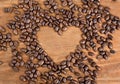 Coffee beans on wooden background.