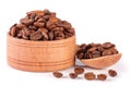 Coffee beans in a wooden bowl with scoop isolated on white background Royalty Free Stock Photo