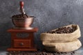 Hand grinding coffee beans in wooden grinder Royalty Free Stock Photo