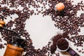 Coffee beans, wooden grinder, portafilter, tamper top view on white background Royalty Free Stock Photo