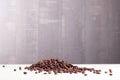 coffee beans on a wooden slide Lightstone table with dark background