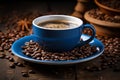 coffee beans on a wooden table with a blue cup and saucer Royalty Free Stock Photo