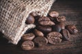 Coffee beans on wooden table close up shot
