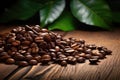 Coffee beans on a wooden table with green leaves background, commercial advertising shoot, closeup. Royalty Free Stock Photo