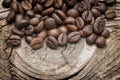 Coffee beans and wooden texture background.