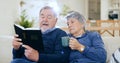 Coffee, bible and a senior couple in their home to read a book together during retirement for religion. Faith, belief or Royalty Free Stock Photo