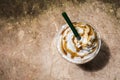 Coffee blend in plastic cup. Served with whipped cream topping.