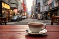 A cup of coffee on the table takes center stage against the city street. tourist in morning in outdoor cafe, breakfast