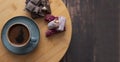 Coffee in blue cup on wooden table . chocolate and turkish sweet Royalty Free Stock Photo