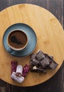 Coffee in blue cup on wooden table . chocolate and turkish sweet Royalty Free Stock Photo