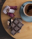 Coffee in blue cup on wooden table . chocolate and turkish sweet Royalty Free Stock Photo