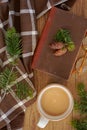 Coffee, book and evergreens top view Royalty Free Stock Photo