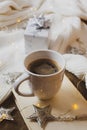 Coffee, book, Merry Christmas train and decorations on a wooden background Royalty Free Stock Photo