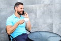 Coffee break brings physical and mental wellbeing. Time to relax. Man sit terrace and drink cappuccino speak phone grey Royalty Free Stock Photo