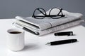 Coffee break business with Newspaper Pen and Glasses Royalty Free Stock Photo