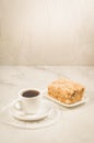 coffee break with a dessert/coffee cup and dessert on a white table Royalty Free Stock Photo