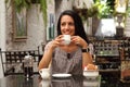 Coffee break for happy young mediterranean woman Royalty Free Stock Photo