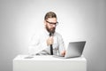 Coffee break! Portrait of handsome happy bearded young businessman in white shirt and black tie are sitting in office and have a Royalty Free Stock Photo