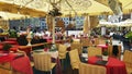 Street Cafe Tables chairs with cup of coffee Flowers City lifestyle Summer Day In Old Town Of Tallinn travel and tourism To Est