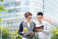 Coffee break. Two cheerful business men talking while one of the Royalty Free Stock Photo