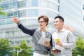 Coffee break. Two cheerful business men talking while one of the Royalty Free Stock Photo