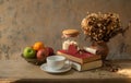 Coffee breakfast,apples and old book with seashell de