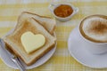 Coffee breakfast with toast with butter and peach jam