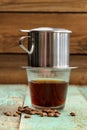 Coffee brewed in small metal French drip filter Royalty Free Stock Photo